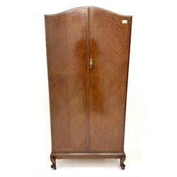 Mid century mahogany gentleman’s wardrobe, arched top, two doors enclosing hanging rail and two linen drawers, cabriole feet