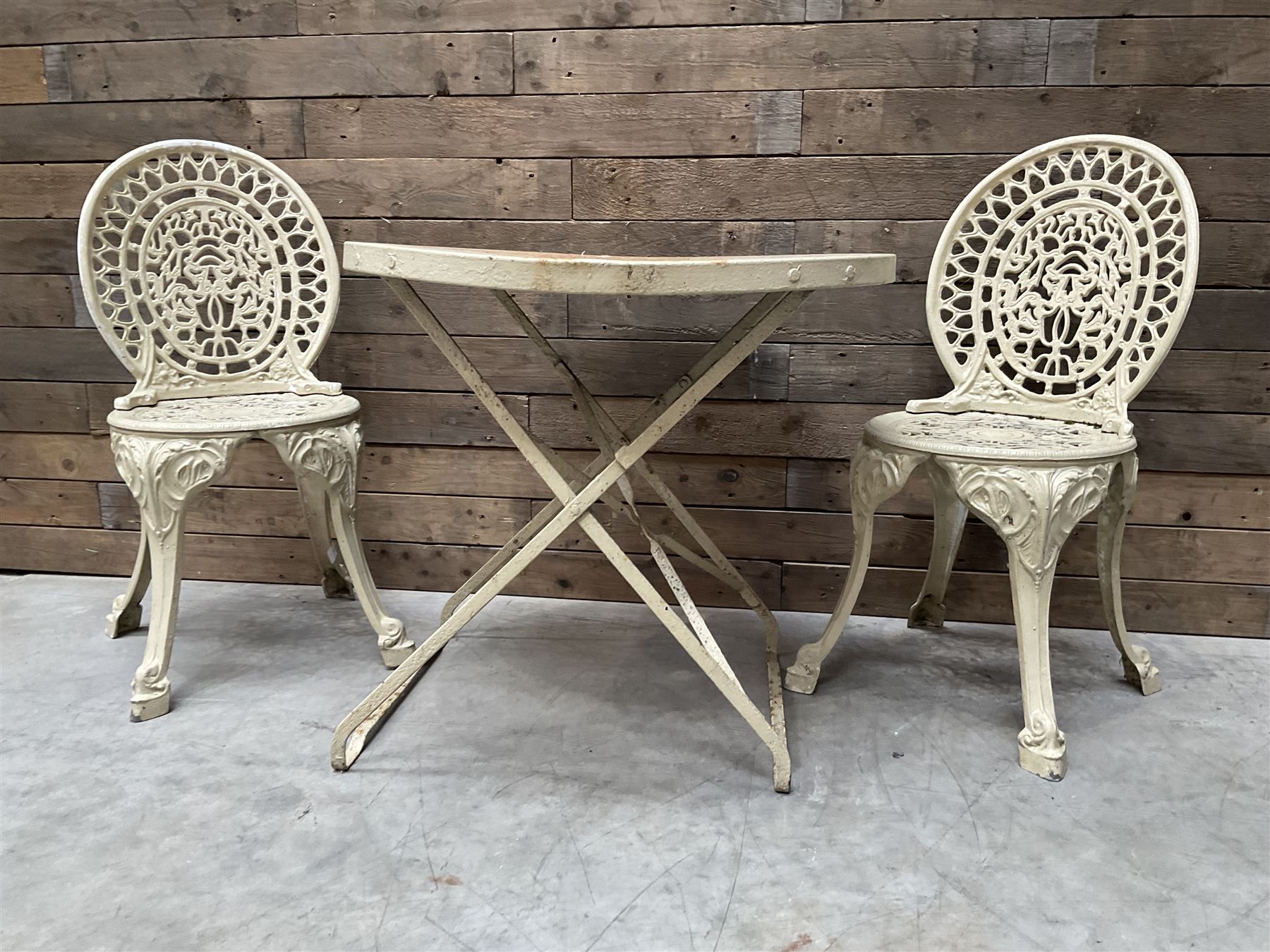Circular cast aluminium garden table (D74cm, H68cm), and two chairs
