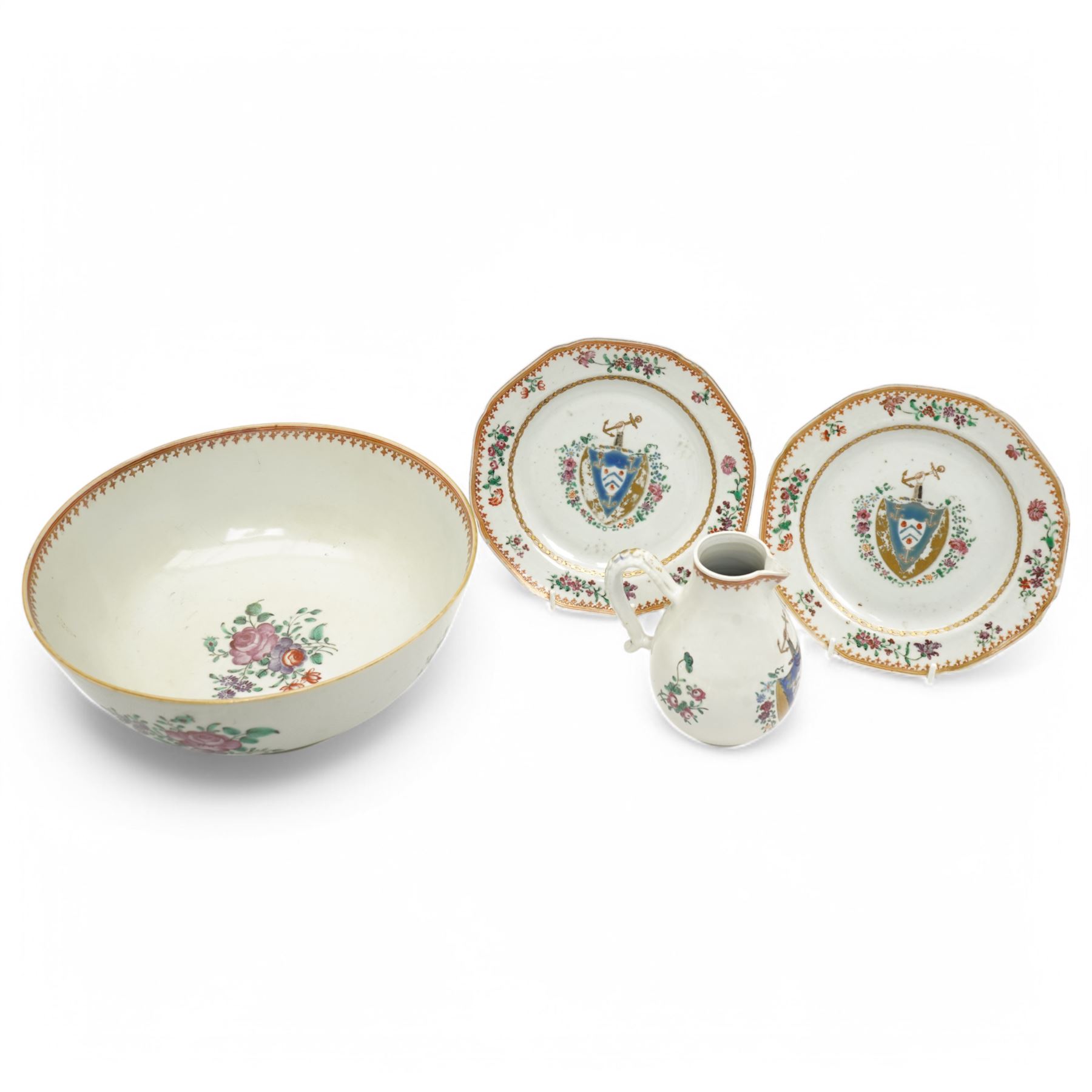 Chinese export Armorial part service decorated with sprays of flowers and a crest of an arm holding an anchor comprising bowl D23cm, pair of octagonal plates 16cm and sparrow beak jug H12cm (4)