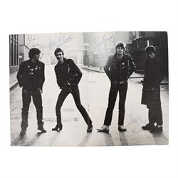 Signed Stiff Little Fingers promotional card, signed by four members of the band Jake Burns, Henry Cluney, Ali McMordie and Jim Reilly, two unsigned promotional cards,  'Go For It' 1981 tour programme and a collection of photographs from the gig