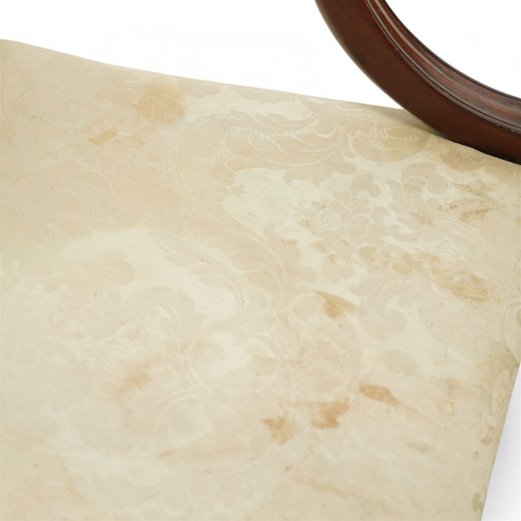 Georgian design mahogany framed Gainsborough armchair, arched cresting rail over shaped arms on curved and moulded supports, upholstered in pale green fabric with repeating foliate pattern, on square tapering moulded supports united by plain stretchers 