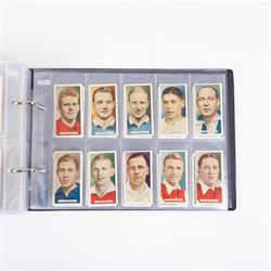 Collection of Edwardian and later Football related trading and cigarette cards, including forty-nine of fifty 1906 Ogden's Football Club Colours, 1922 PALS Footall series, ninety of one hundred 1925 Gallaher Famous Footballers, complete set of forty-four 1926 Ogden's Captains of Association Football Clubs and Colours, complete set of fifty 1927 Players Football Caricatures by MAC,  complete set of fifty 1927 Players Football Caricatures by RIP,  complete set of fifty 1930 Players Association Cup Winners, complete set of 50 1933 Ogdens AFC Nicknames etc, housed in brown cigarette card album