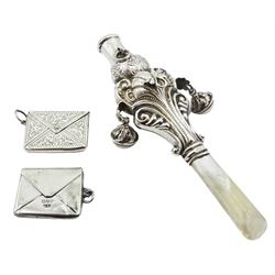 Early 20th century silver mounted child's rattle, the shaped scrolling silver body with suspension bells, floral embossed whistle and mother of pearl handle, hallmarked Crisford & Norris Ltd, Birmingham, date letter indistinct, L11.5cm, together with two silver stamp holders modelled as envelopes, the first example hallmarked Albert Ernest Jenkins, Chester 1911, the second stamped Sterling Silver, approximate gross weight 1.38 ozt (43 grams)