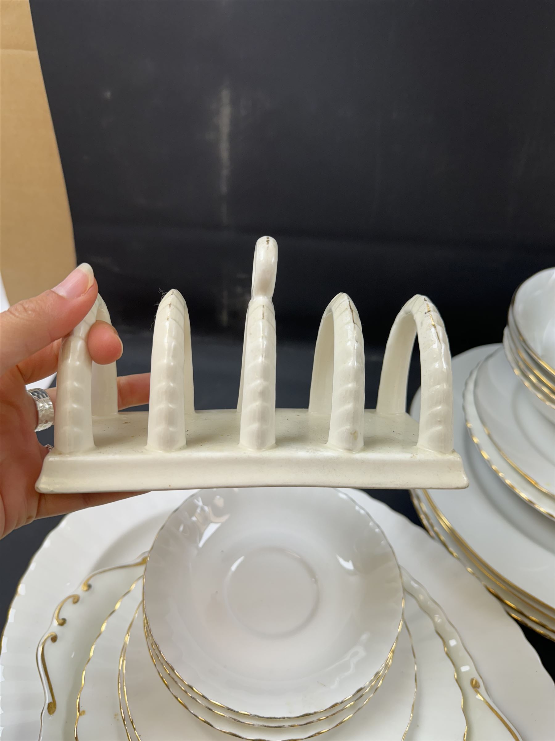 Royal Albert Val D'or part tea and dinner service, including two coffee pots, two teapots, milk jug, covered sucrier etc together with matching items 