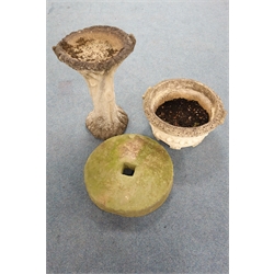  Composite stone tree effect bird bath (H65cm) a composite stone circular tapering planter (D56cm, H28cm) and a mill stone (D55cm)  