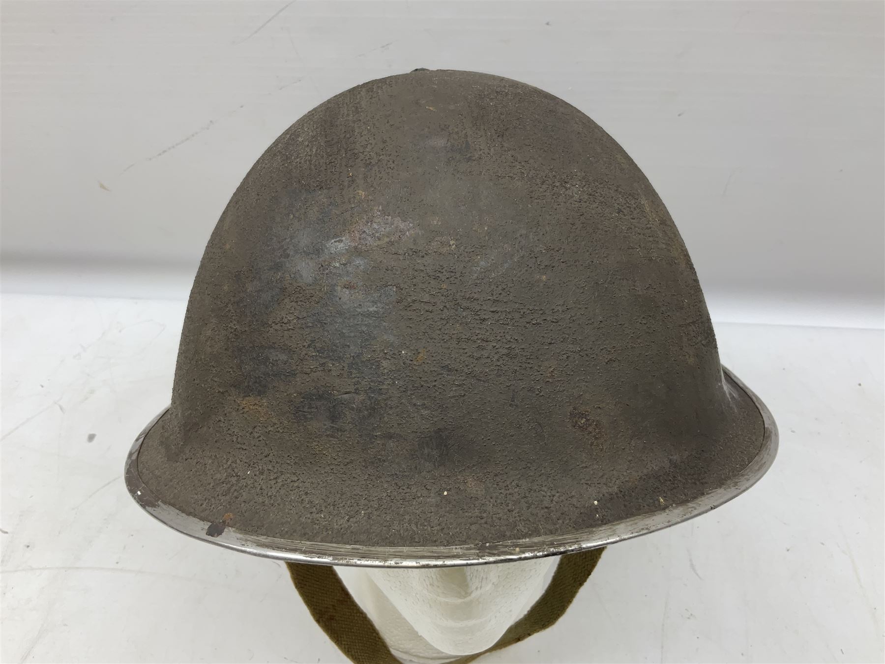 WW2 British Mk III steel combat helmet with textured finish and original liner