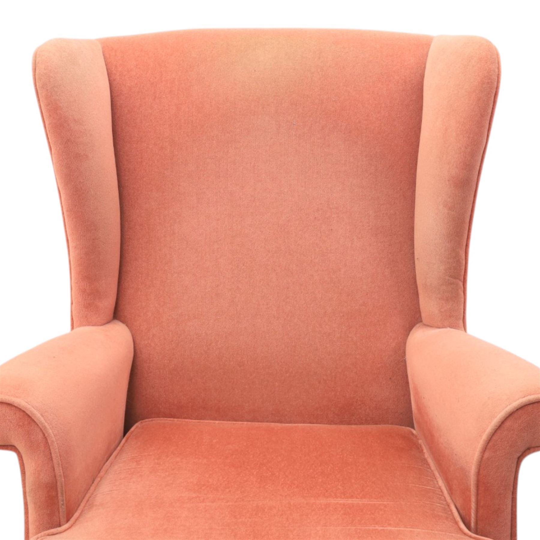 Parker Knoll - mid-century armchair suite, 'Model N30' recliner armchair with headrest and deep buttoned seat and back raised on castors, a wide armchair with deep button back and seat raised on castors, a wingback chair with flared scrolled arms, raised on cabriole supports