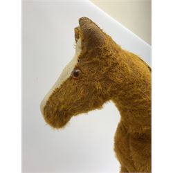 Pedigree push along plush covered horse 1950s-60s with red tubular metal framework and beech foot rests H25