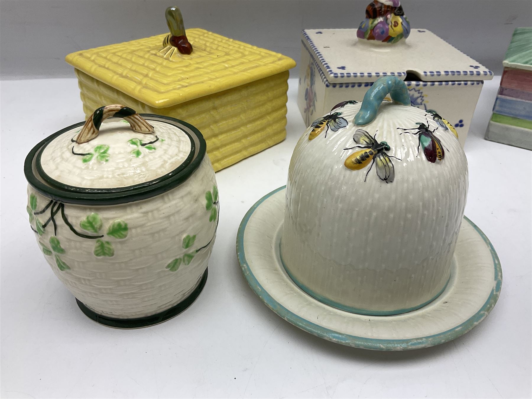 Clarice Cliff for Wilkinson Ltd Crocus Bizarre beehive honeypot painted in the Crocus pattern, together with two beehive Beswick honey pots, Poole square honey pot etc (14)