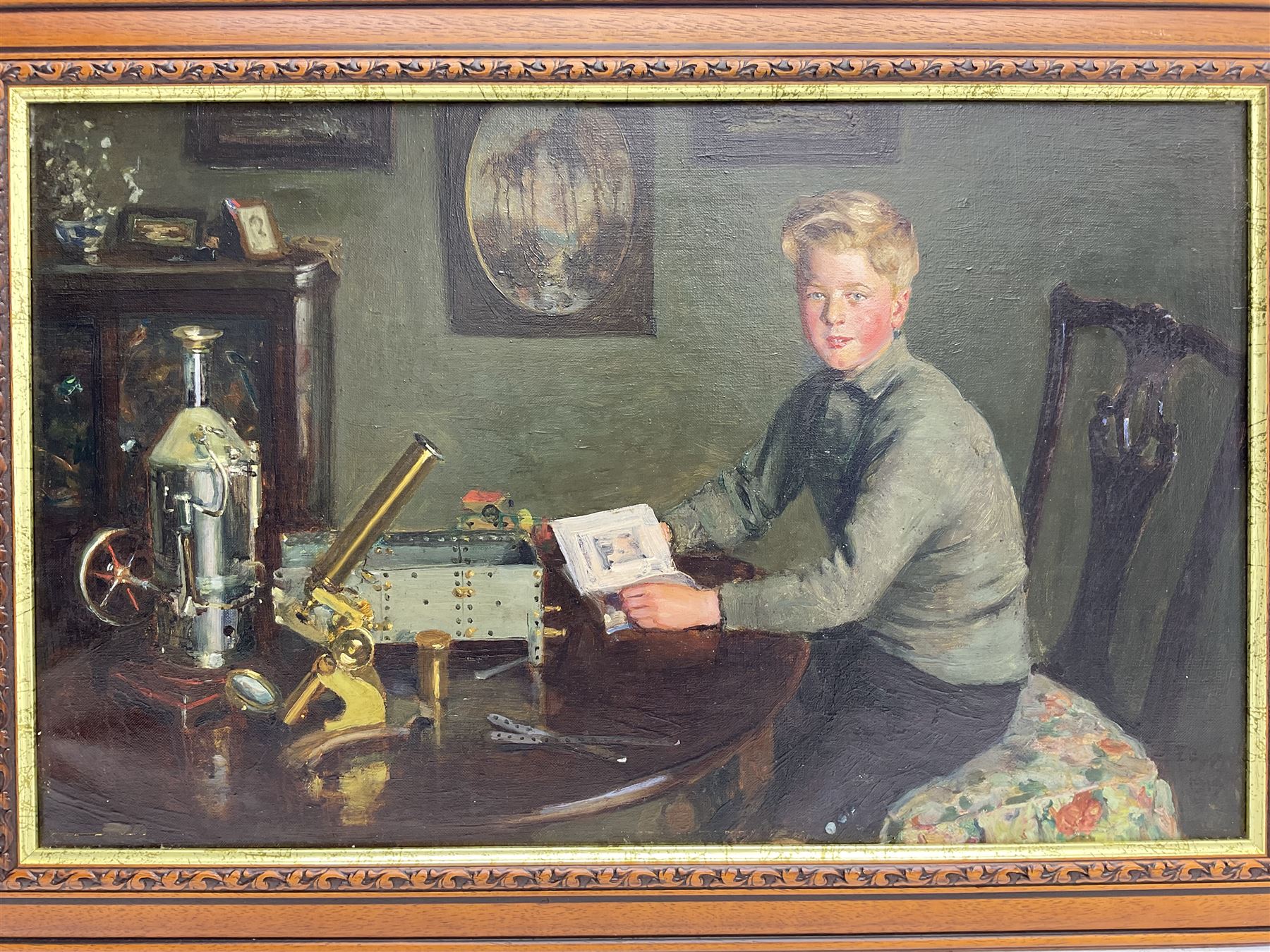 Circle of Charles Spencelayh (British 1865-1958): The Young Scientist, oil on canvas indistinctly signed and dated 1919, 40cm x 65cm