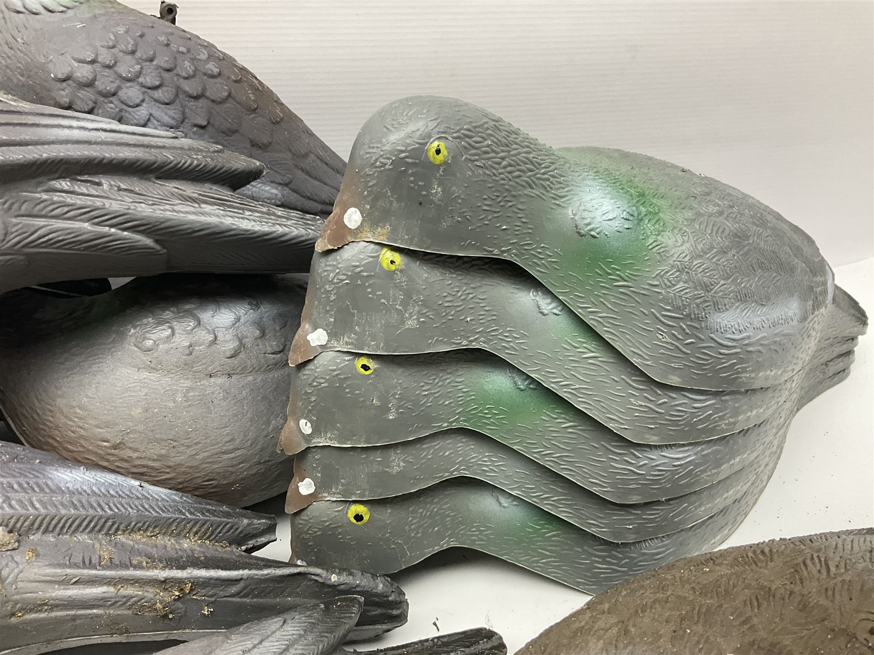 Eighteen plastic pigeon decoys comprising ten full body and eight shells with quantity of various stakes; some marked made in Italy