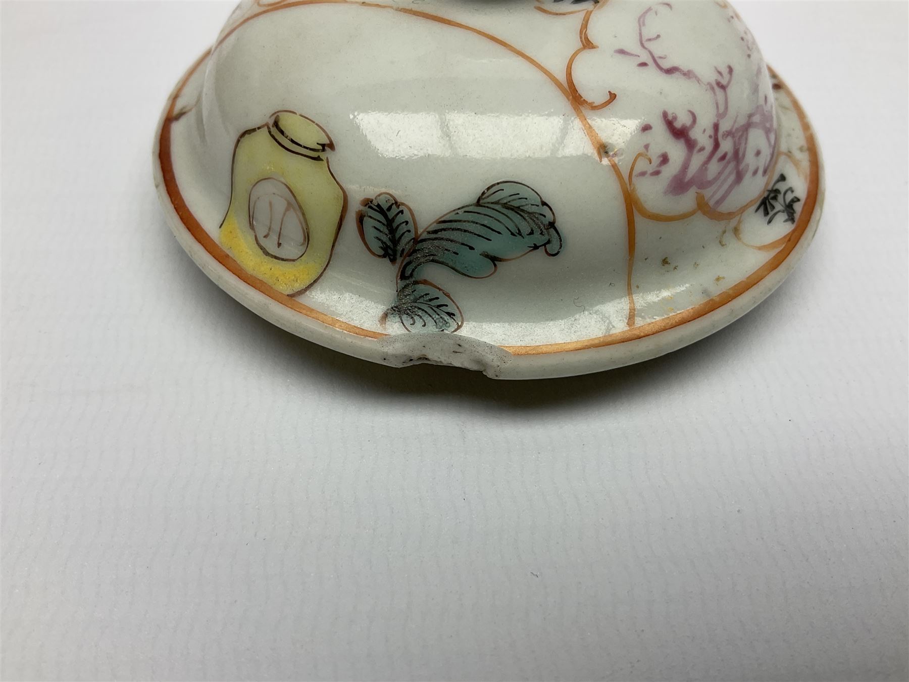 Two late 18th/early 19th century Chinese export teapots, the largest example of globular form with curved handle and straight spout, decorated in the Mandarin style with figural scenes surrounded by red scale reserves, H13.5cm, the second smaller example decorated in underglaze blue with two musicians in a landscape set with willow tree and fence, H10.5cm

