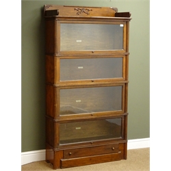  Early 20th century mahogany Globe Wernicke four tier library bookcase, shaped raised back with carved detailing, glazed doors above single drawer, W94cm, H172cm, D30cm,  