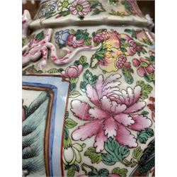 Large pair of 19th century Cantonese famille rose vases, each painted with various courtly scenes, including a display of warriors fighting on horseback before an official and his attendants, double Buddhist lion handles and applied at the shoulders with chilong, the lower band painted with Greek key motif, H58cm (2)