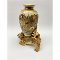 20th century Satsuma vase, of ovoid form decorated with figures within a landscape, mounted upon a gilt dog of foo, with character mark beneath, H26cm 