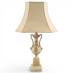 Table lamp modelled as a twin handled urn, decorated in relief with floral sprigs, upon a ...