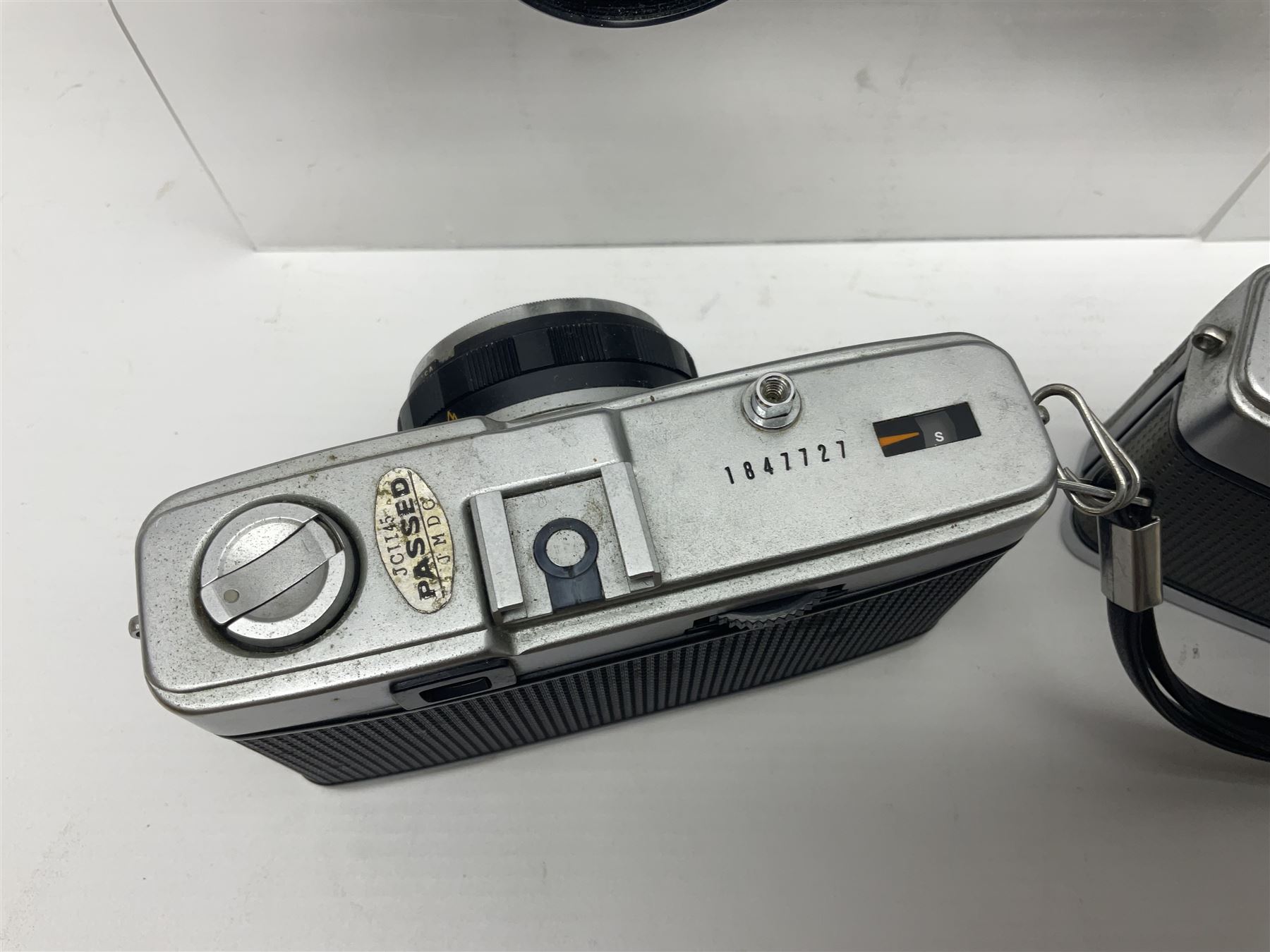 Olympus Pen-EE camera, serial no 415299, with Olympus D.Zuiko 1:3.5 f=2.8cm lens, together with four Olympus Trip 35 cameras, serial nos 4759245, 4257589, 1847727 and 5387611, each with Olympus D. Zuiko 1:28 f=40mm lenses