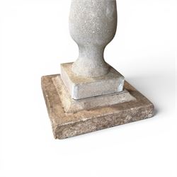 Weathered cast stone statue of a child and urn planter on pedestal along with three piece bird bath