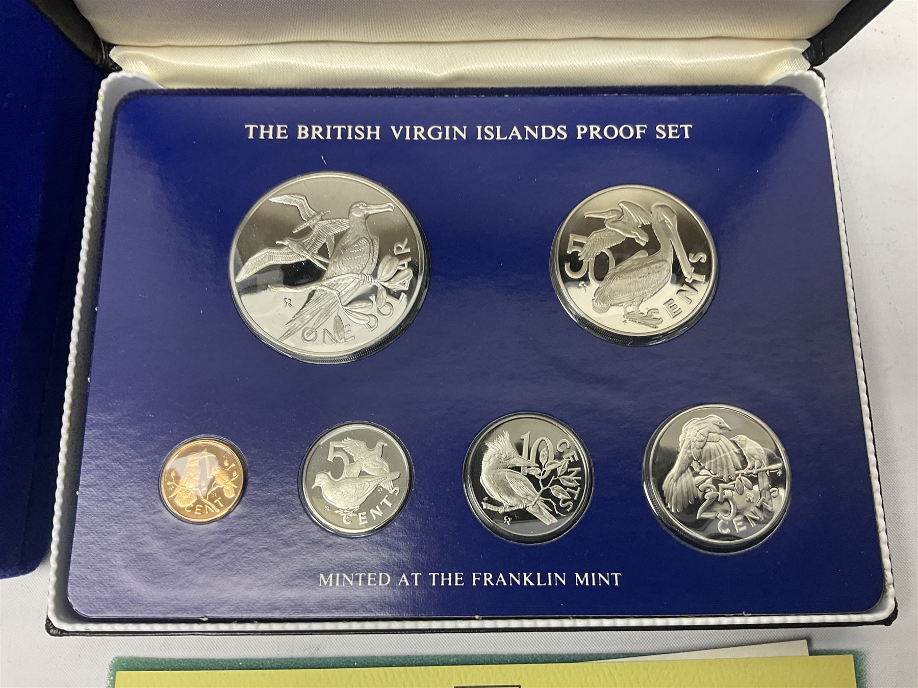 Four British Virgin Islands proof coin sets, comprising First Coinage of the British Virgin Islands 1973 proof six coin set, containing silver one dollar coin, 1977 and 1979 proof sets, containing high denomination silver coins, and The Royal Coronation Jubilee 1977 six coin silver proof set, each minted at the Franklin Mint, all cased with certificates, and a Solomon Islands 1978 proof seven coin set, containing silver five dollar coin, minted at the Franklin Mint, cased with certificate (5)
