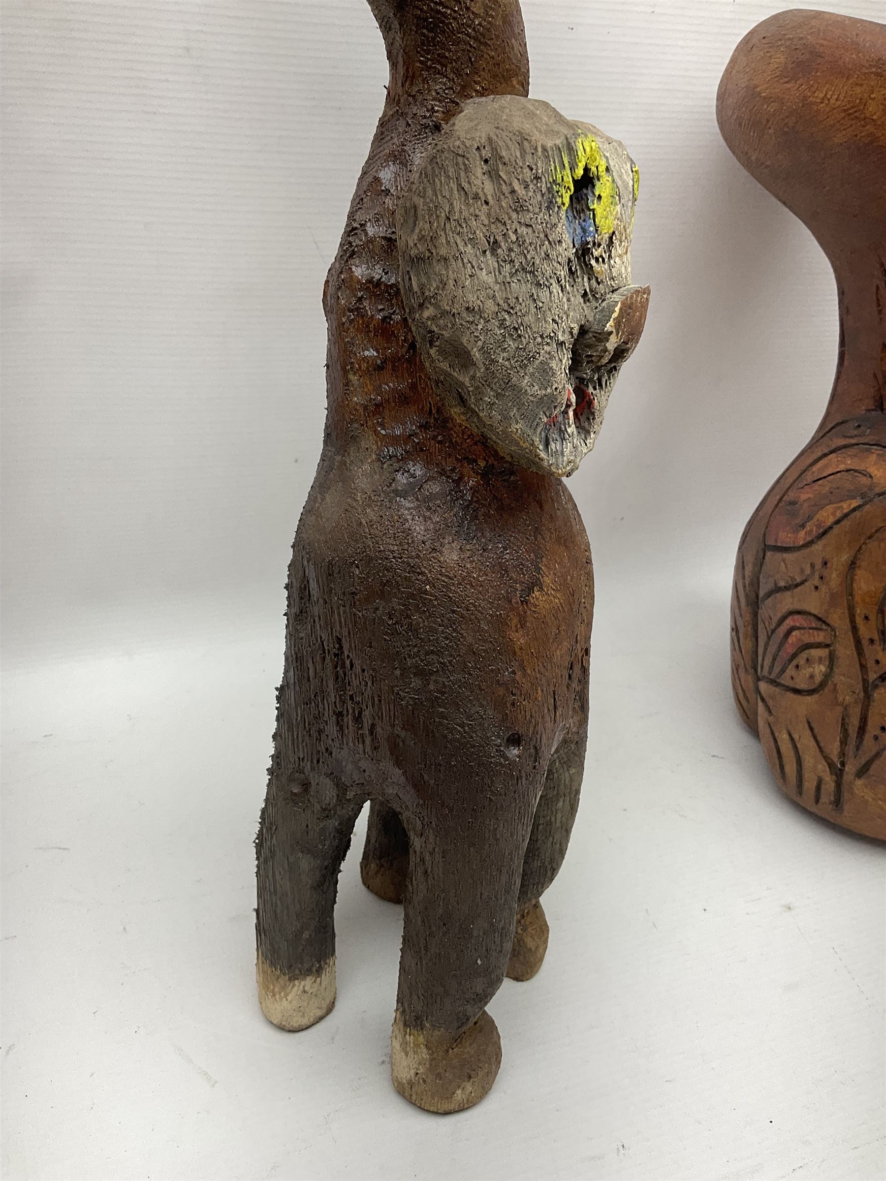 Helen Skelton (British 1933 – 2023): Three carved wooden abstract sculptures, each modelled as a cat, with carved or painted features, largest H63cm. Born into an RAF family in 1933 in Kent and travelled the world extensively during her childhood. After settling in Bridlington, Helen immersed herself in painting, textiles, and wood sculpture, often inspired by nature's beauty. Her talent was showcased in a one-woman show at Sewerby Hall and recognised with the sculpture prize at Ferens Art Gallery in 2000. Sadly, Helen’s daughter passed away from cancer in 2005. This loss inspired Helen to donate her sculptures to Marie Curie upon her passing in 2023.