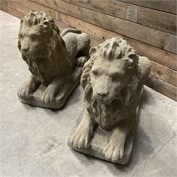 Pair of large cast stone Langport recumbent garden lions, rectangular plinth base