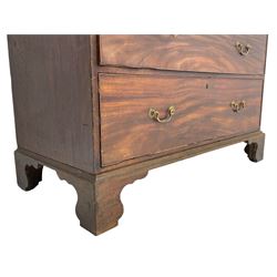 George III mahogany Gentleman's linen press, the projecting cornice over two panelled cupboard doors enclosing three sliding trays, the base fitted with two short over three long graduating cock-beaded drawers, lower moulded edge over bracket feet