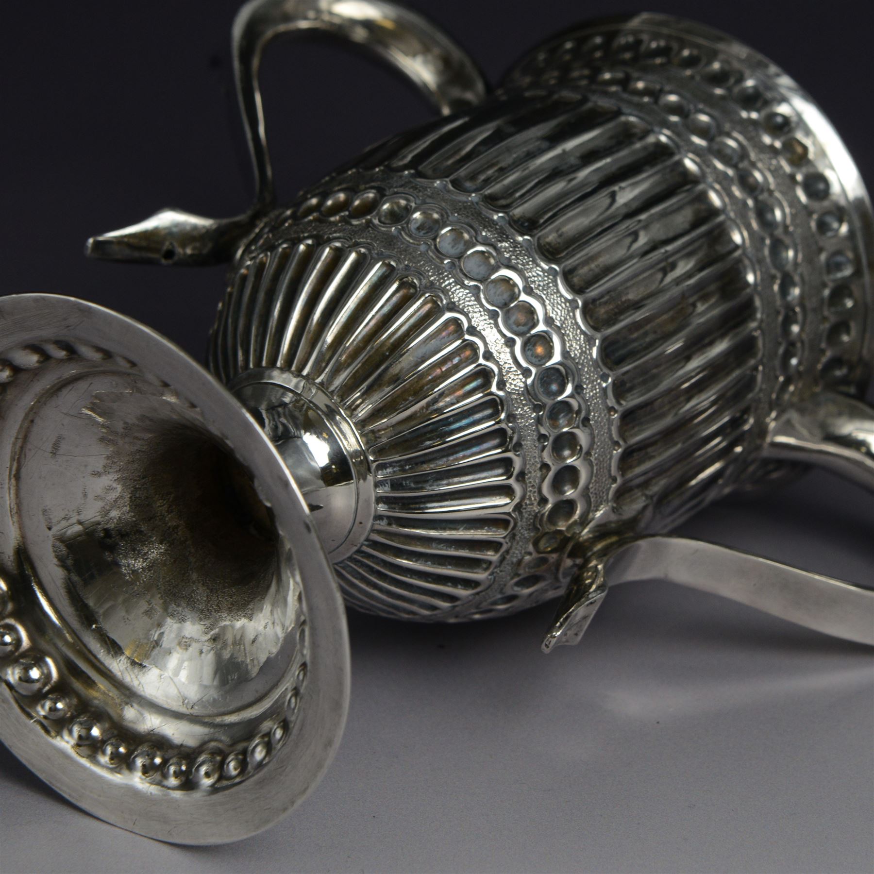 George III silver twin handled trophy cup, of typical form with twin C scroll handles and upon a domed circular foot, the body with repousse and chased fluting and C scroll decoration, with later presentation engraving to cartouche, hallmarked London 1803, maker's mark slightly rubbed but probably for Peter, Ann and William Bateman, H16cm