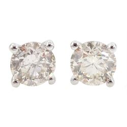 Pair of 18ct white gold round brilliant cut diamond stud earrings, stamped 750, total diamond weight approx 1.05 carat