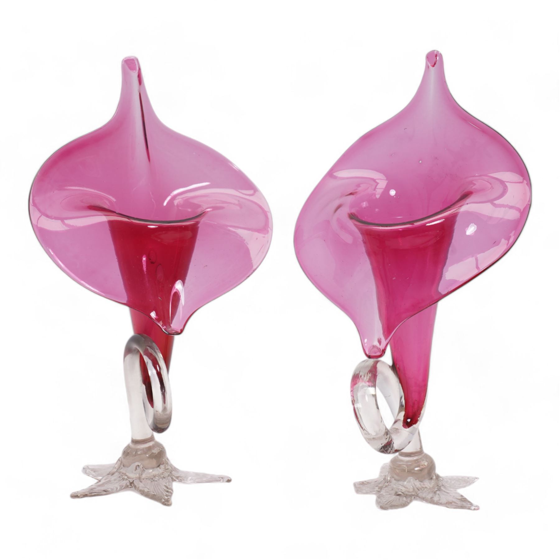 Early 20th century Bohemian cranberry glass flower form plate, overlaid with opaque and hand painted and gilded with a floral bouquet, D19.5cm, pair of cranberry glass pulpit vases, satin glass ewer and two further pieces of cranberry glass (6)