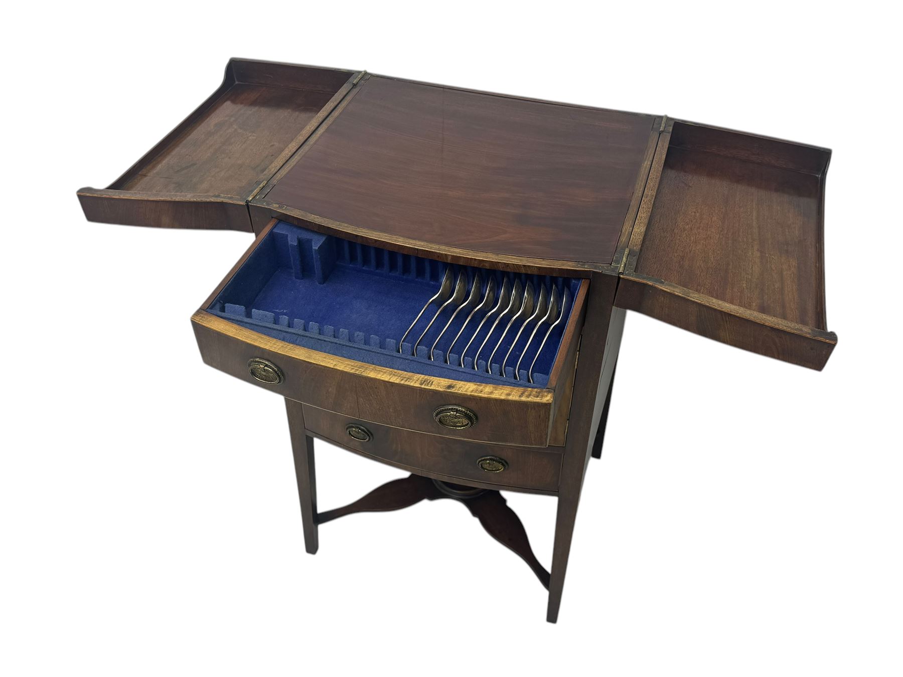 Part canteen of silver plated cutlery, including ivorine handled table and dessert knives, table forks, dessert forks, dessert spoons, teaspoons and soup spoons, all contained within a canteen cabinet converted from a George III mahogany enclosed wash stand
