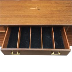 G Plan - ‘Librenza’ tola wood sideboard, the rectangular top above two cupboards to either side and three graduated central drawers, the drawer and door fronts veneered in figured tola wood with brass handles, standing on splayed tapering legs