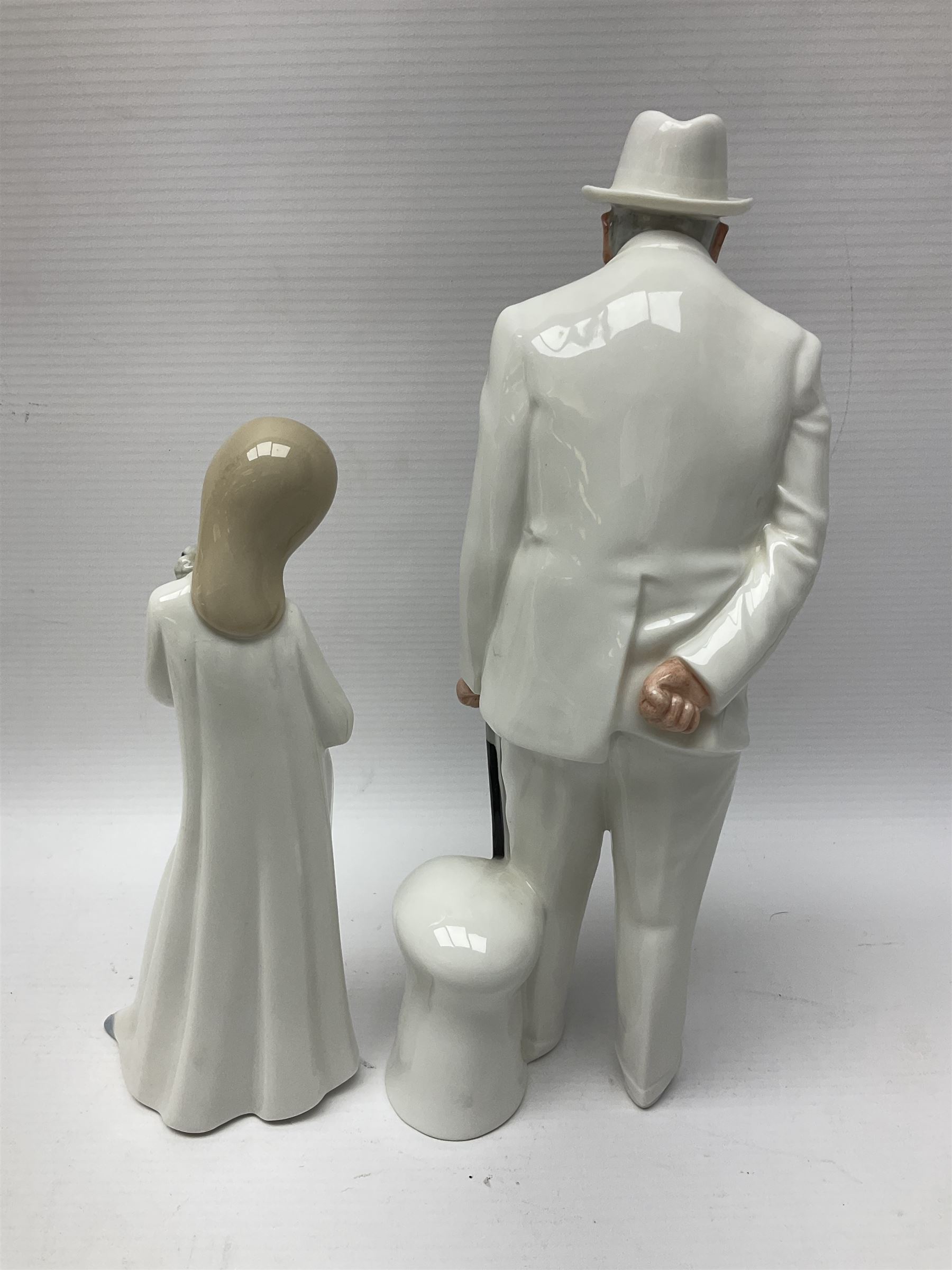 Six Royal Doulton figures, including Sir Winston Churchill HN3057, Peace HN2470, Lovers HN2762 etc, together with Lladro rabbit, and three Nao figures 