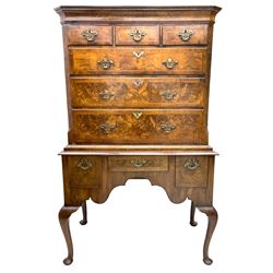 Georgian figured walnut chest on stand, the projecting stepped cavetto cornice over three short and three long graduating drawers flanked by fluted canted corners, the stand with shaped apron fitted with three drawers, on cabriole supports