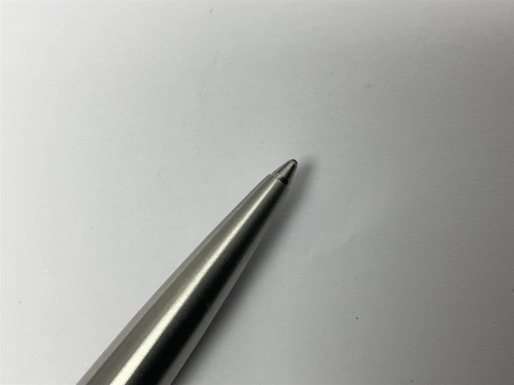 Three fountain pens, to include Conway Stewart 'Dinkie 550' and 'Conway 57' and a Parker 'Slimfold', all with 14ct gold nibs, together two roller ball pens, including a Parker example and a Swarovski Crystal paperweight