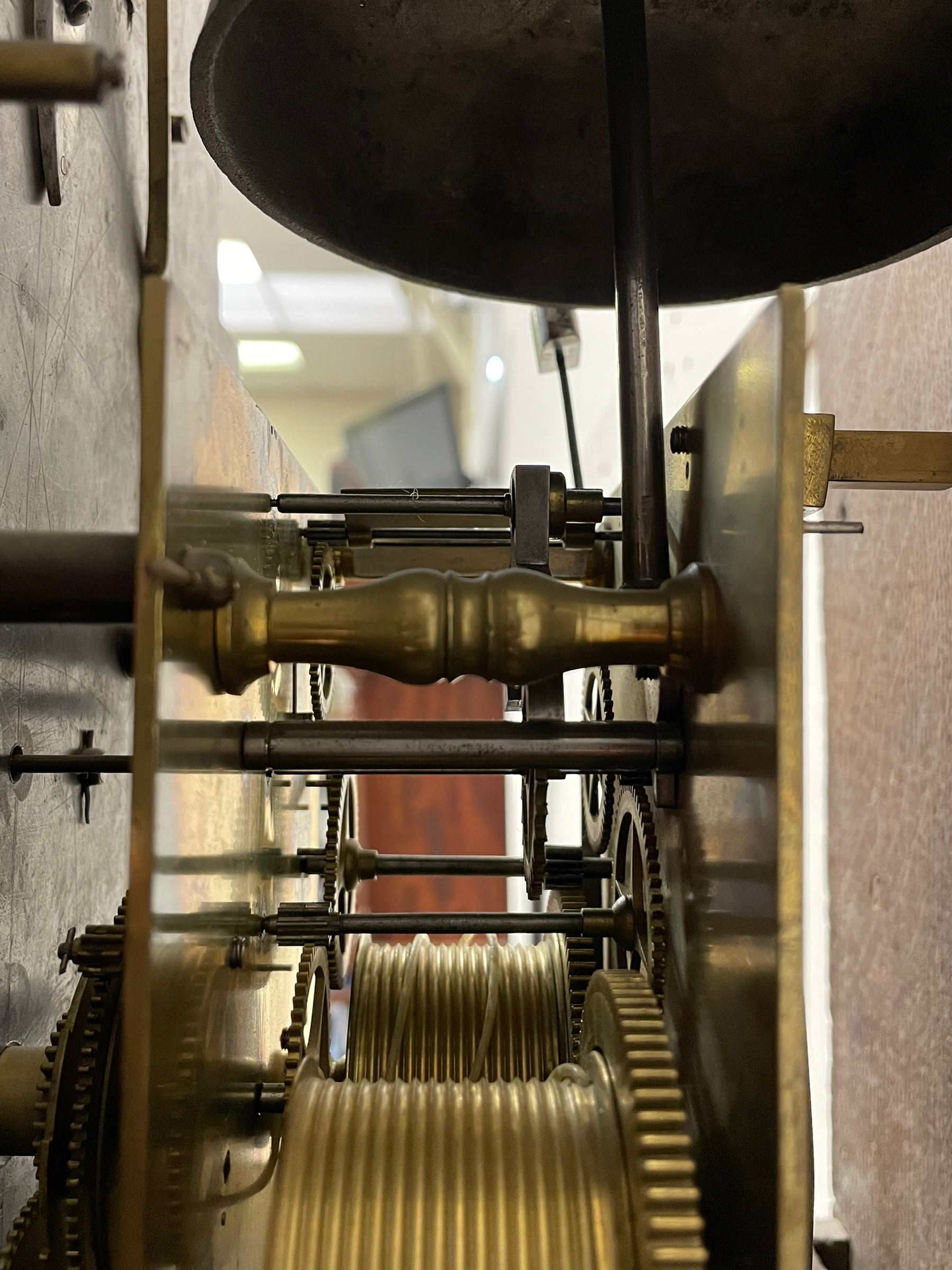 Henry Hindley of York – mid-18th century oak cased 8-day longcase clock,
flat topped caddy pediment with gesso finials, rectangular hood door flanked by wooden turned pilasters with capitals, canted trunk with a full-length break arch topped door on a short plinth with applied skirting and bracket feet, brass dial with a silvered chapter ring, Roman numerals and five-minute Arabic’s, minute and inner quarter hour tracks, matted dial centre with subsidiary seconds dial, blued steel hands and female head pattern spandrels, silvered calendar dial to the break arch with dolphin spandrels, four pillar rack striking movement, striking the hours on a bell. With weights and pendulum. 
H250 W48 D27
Henry Hindley originally from Wigan (Lancs) is recorded as working in York from Petergate 1731-41 then Stonegate 1741-1771. A famous and highly innovative maker, often referred to as the “Tompion of the North.” 
