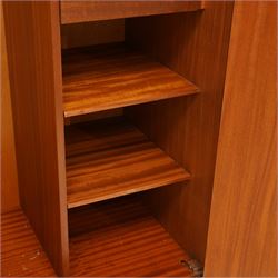 G Plan - 'Fresco' teak double fitted gentleman's wardrobe, twin doors enclosing two sections, a single clothes rail and drawers and shelving, on a recessed plinth base