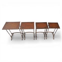 20th century mahogany quartetto nest of tables, the rectangular tops with oval inlay, upon turned knopped supports, united by a curved stretcher, raised upon outswept feet