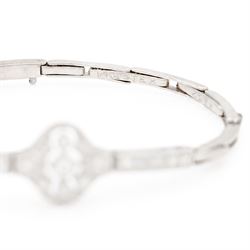 Art Deco white gold and platinum diamond bracelet, the central articulated panel milgrain set with old and single cut diamonds, to a white gold expanding link bracelet, stamped 18ct