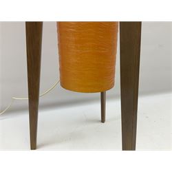 Mid century floor standing rocket lamp, the spun cylindrical orange fibreglass shade supported by three tapering teak legs, H112cm