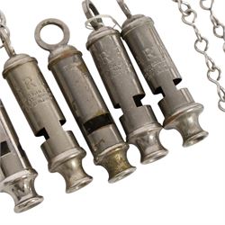 Collection of WWII ARP warden's whistles and similar together with RAF badge and similar 