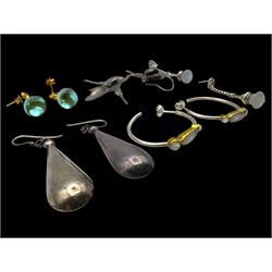 Six pairs of silver earrings, including opal pendant earrings and a pair of moonstone hoop earrings