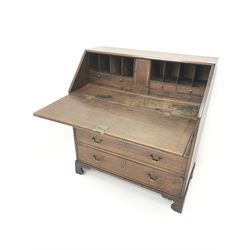 Georgian oak bureau, single fall front enclosing fitted interior above four graduating drawers, shaped bracket supports