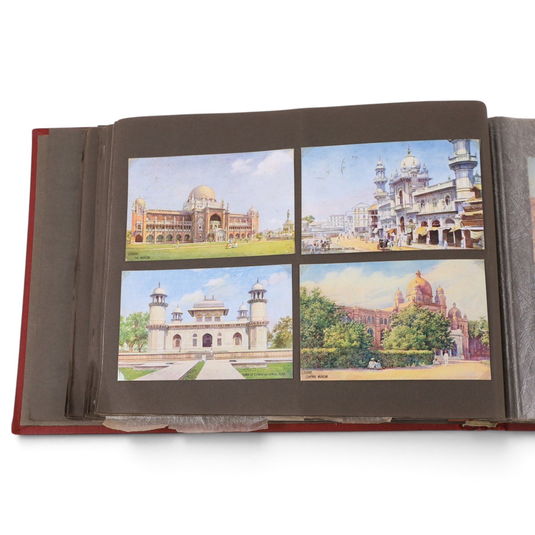 Two early to mid 20th century postcard albums, containing black and white and colour postcards, the first labelled Meine Reisen in Indien containing postcards of Arabia, India, Egypt, some personal photographs and newspaper clippings, of postcards, the second labelled Meine Reisen in England, containing mostly postcards of London, some greetings cards etc
