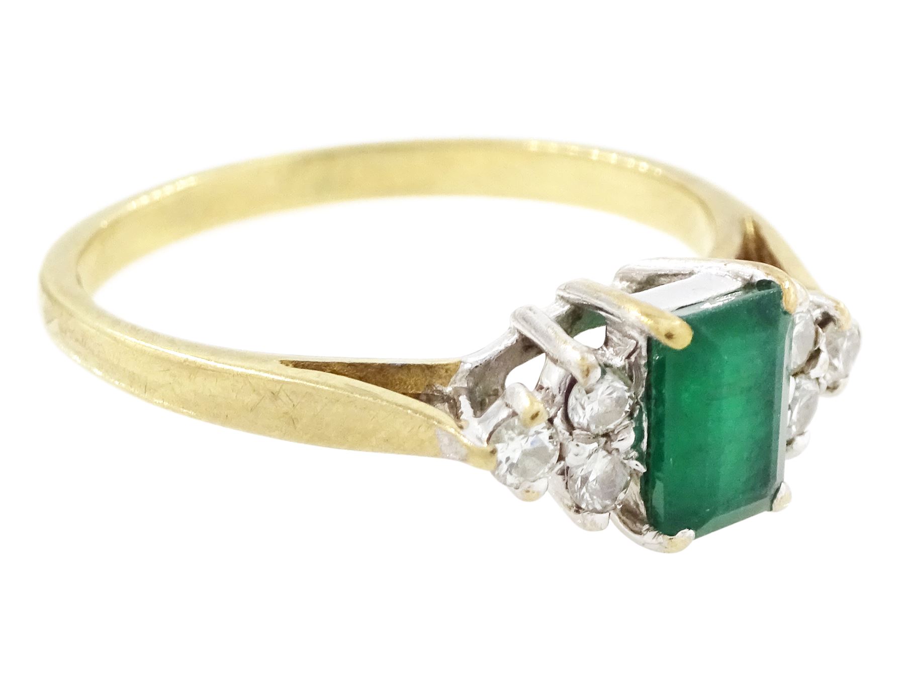 9ct gold emerald and diamond ring, single octagonal cut emerald of approx 0.45 carat, set between brilliant cut diamond trefoil shoulders