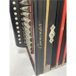 Three European concertinas, comprising Viceroy German concertina with 21 keys, hexagon wooden frame and 8 fold bellows
Oak framed concertina with 12 keys and 8 fold bellows
Commander concertina with 12 keys and 12 fold bellows
With tutor