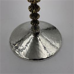 Pair of modern silver goblets by Stuart Devlin, the tapering cylindrical bowls each with spot hammered decoration and gilt interiors, the parcel gilt stems with signature textured detailing and six graduating knops, upon conforming spreading circular foot, hallmarked Stuart Devlin, London 1976, H17.7cm