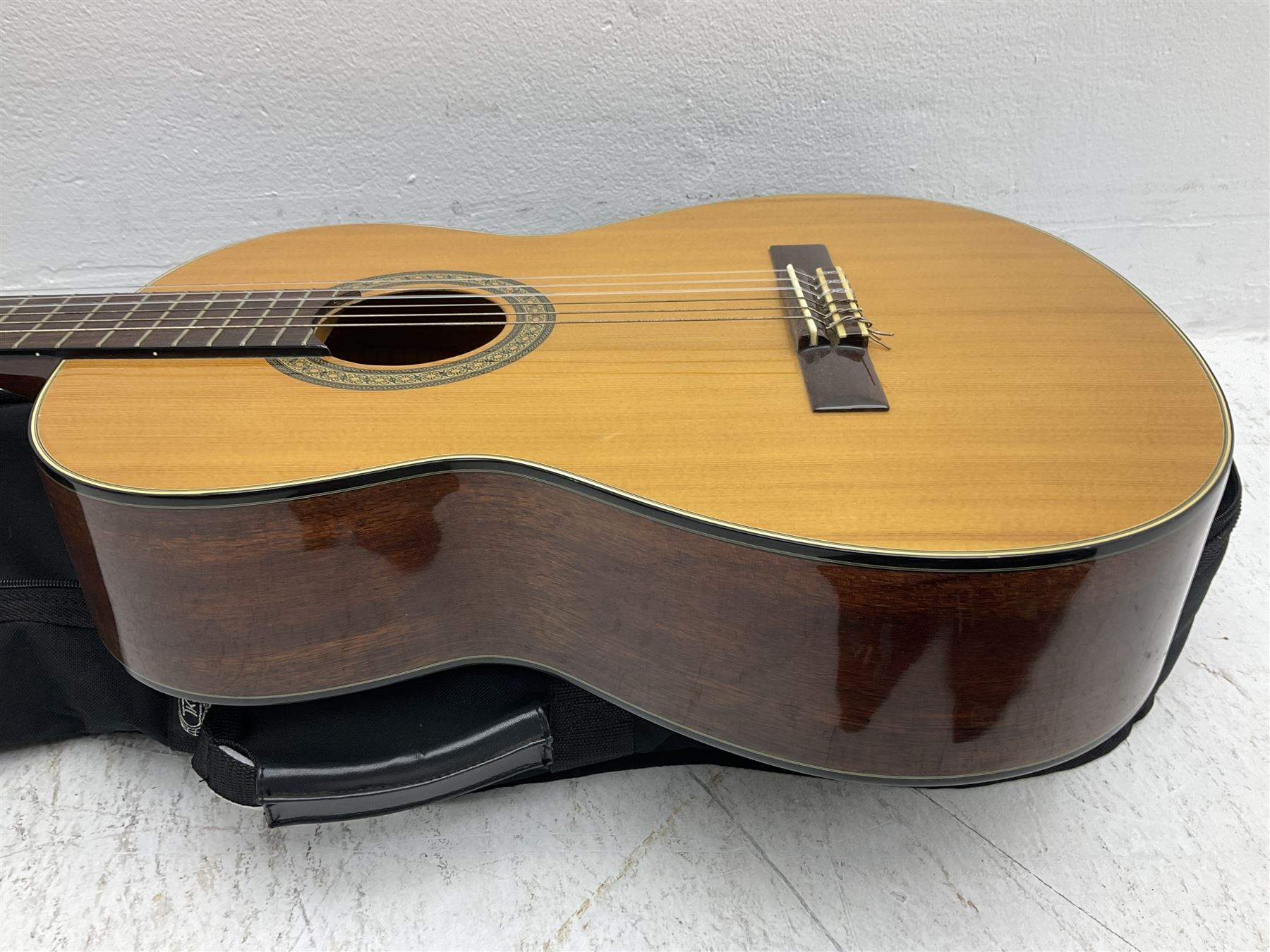 Nagoya Suzuki Model SC240 acoustic guitar with mahogany back and ribs and spruce top, bears label, L101cm; in soft carrying case