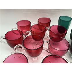 Collection of 19th century coloured glasses, to include nine cranberry glass punch cups, each with clear glass handle and foot and a set of six green glasses, with short clear stems, tallest H10cm