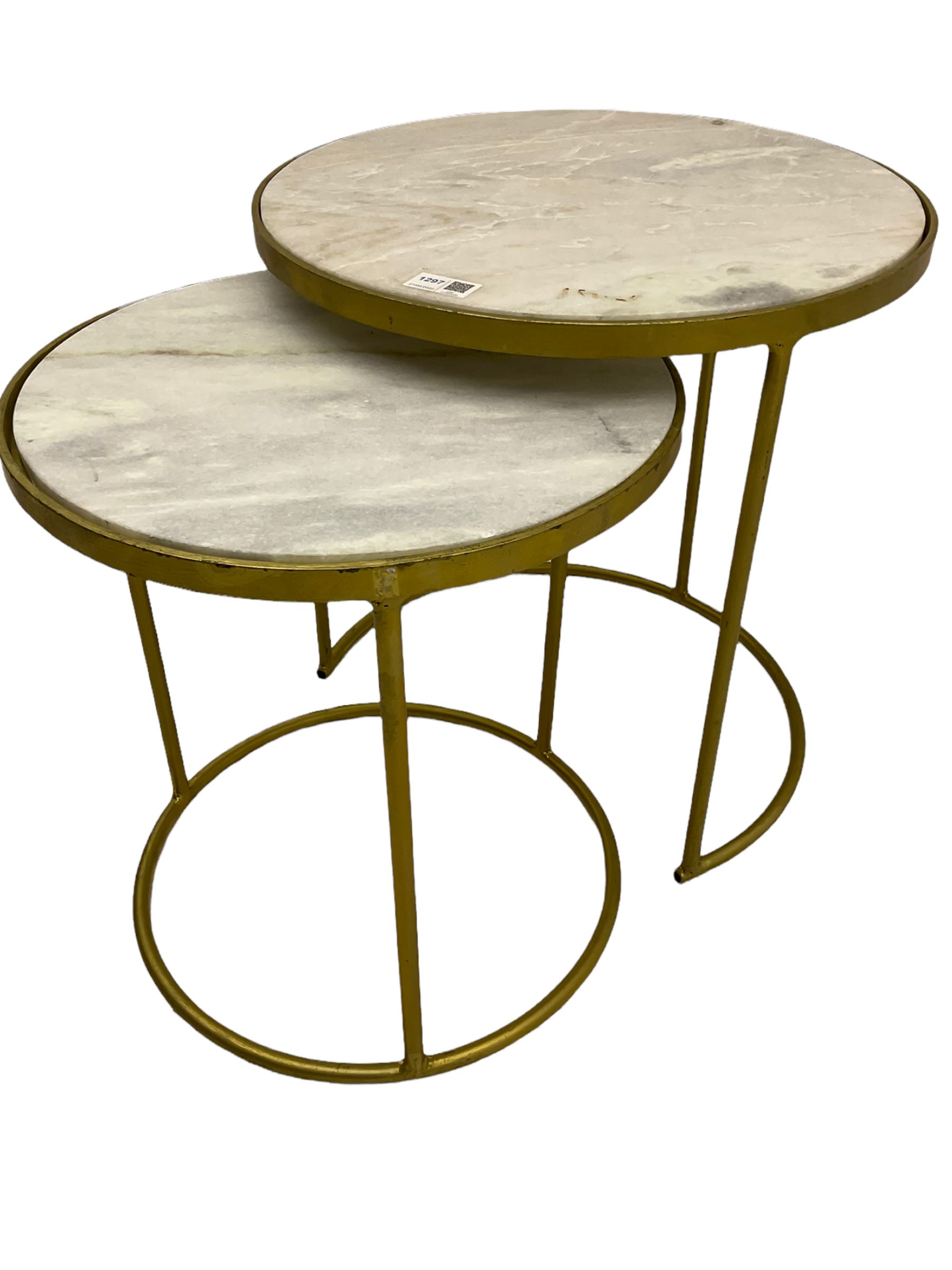 Two contemporary nesting side tables, circular gilt metal frames with