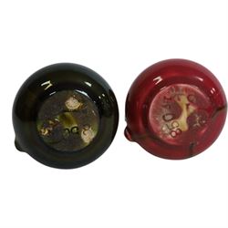 Christopher Dresser for Linthorpe Pottery, two of miniature jugs in red and green, shape number 850, with impressed mark beneath, H9cm